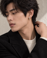 Channel Huggie Earrings - male close-up