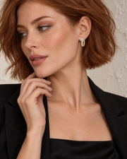 Channel Huggie Earrings - female close-up